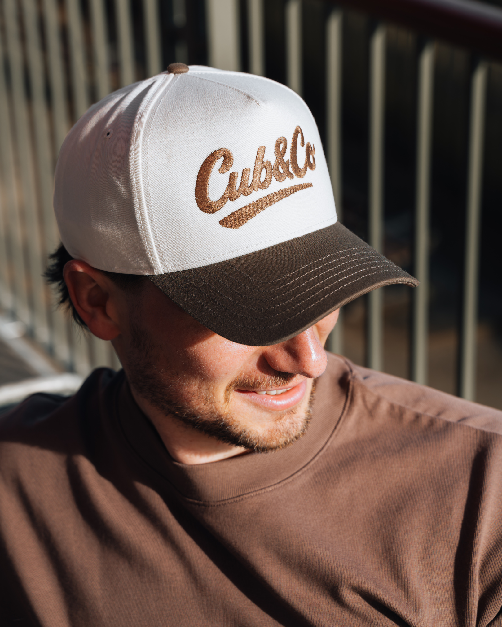 Man wearing a cap with &