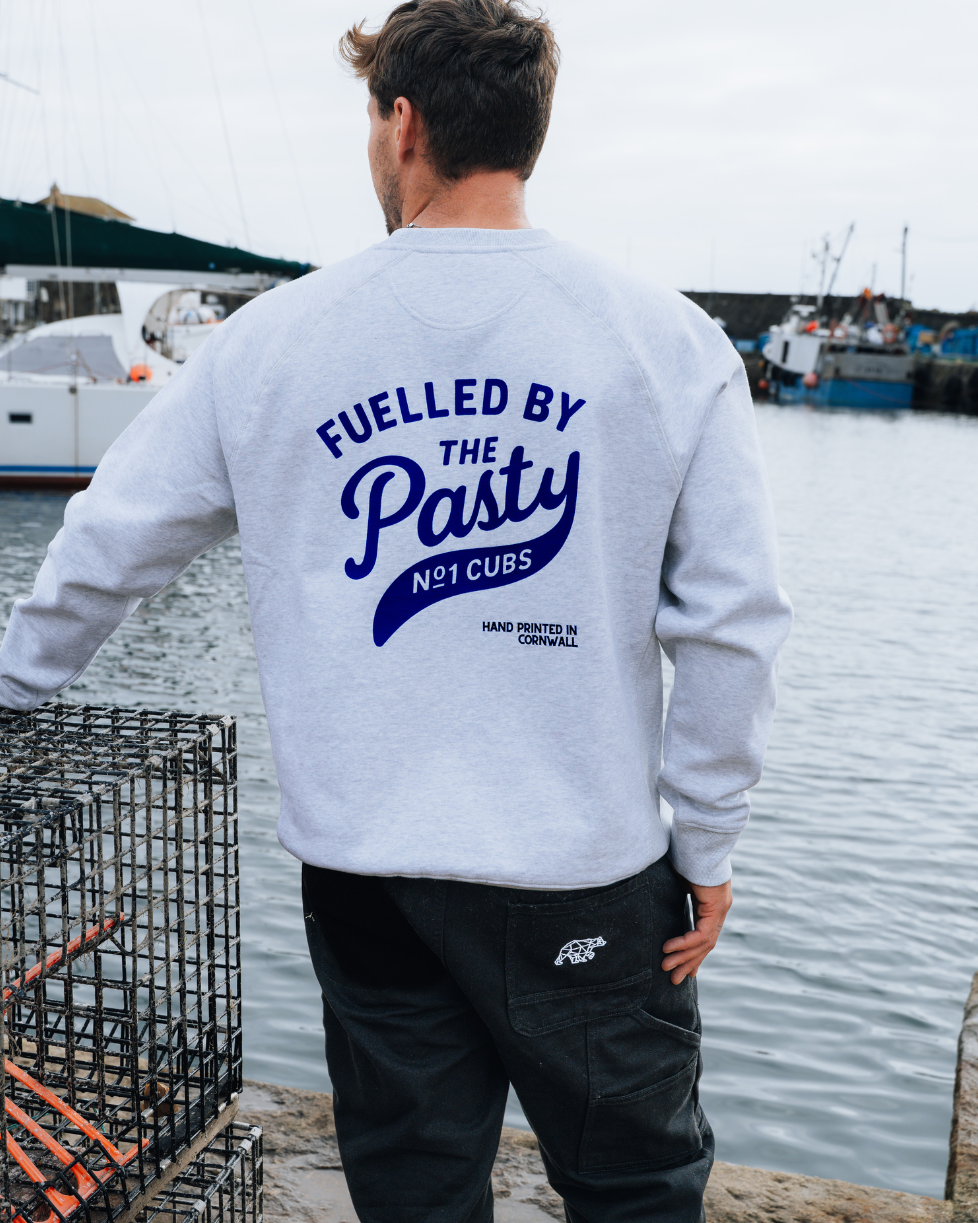 Person wearing a sweatshirt with &