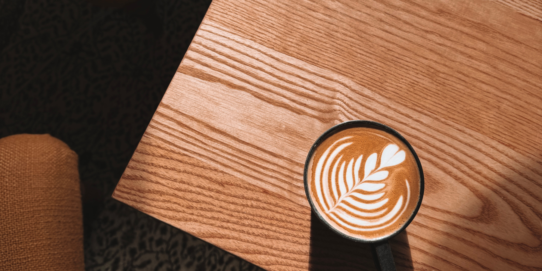 Flat white on an oak table